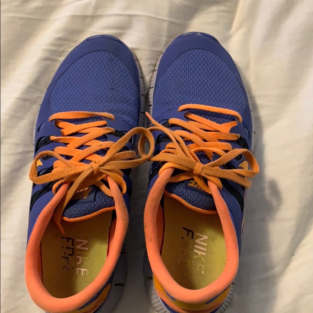 Blue and orange Nike free running shoes